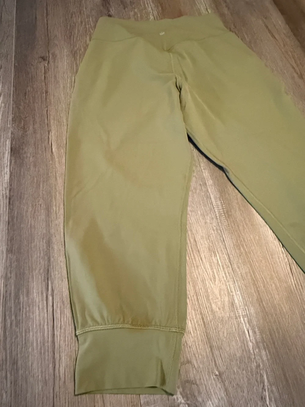 Lululemon Align High-Rise Cropped Jogger Capris in a bronze green color.